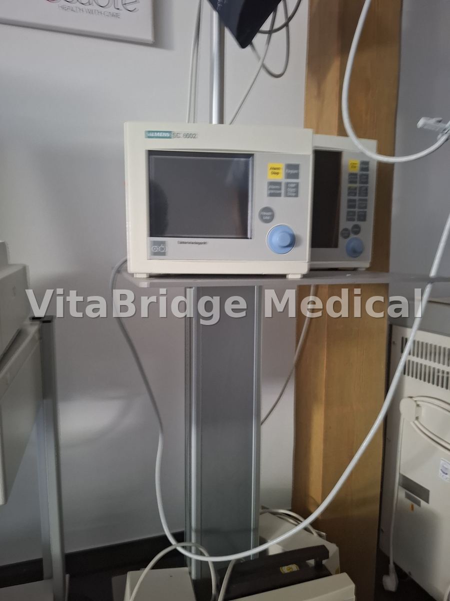 Siemens SC 6002 patient monitors on wall rail